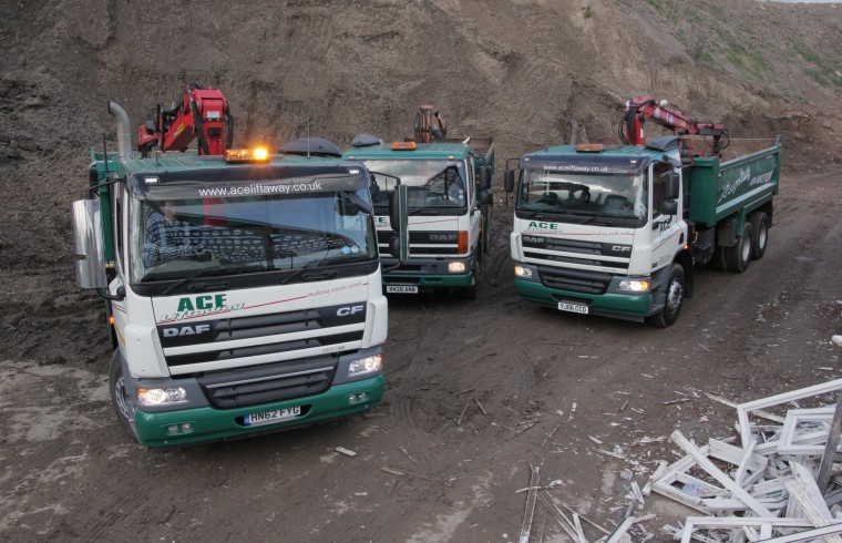 3 Ace vehicles at a quarry.